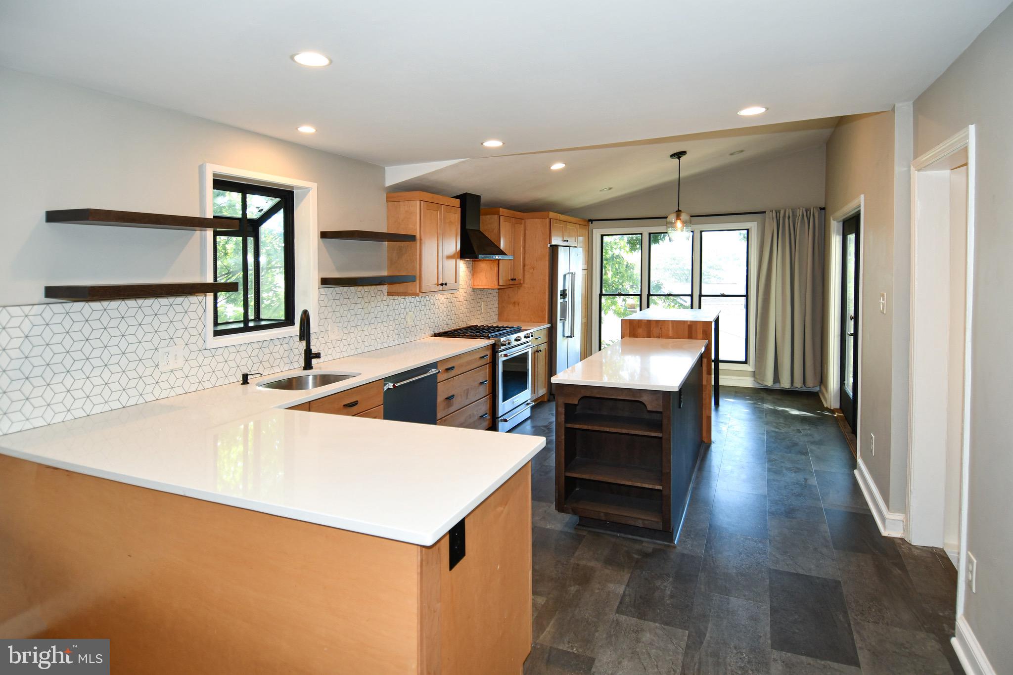 2100 South Quebec Street Arlington, VA 22204 - Photo 10 of 36 a kitchen with a sink and chairs