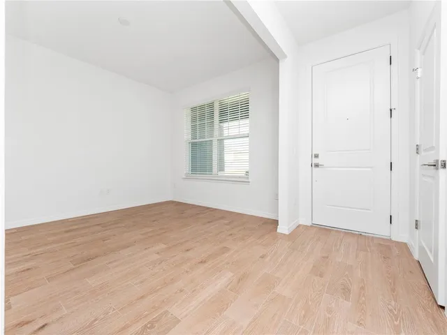 a view of an empty room with a window