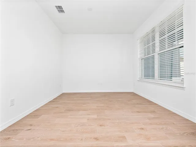a bathroom with a sink toilet and a mirror