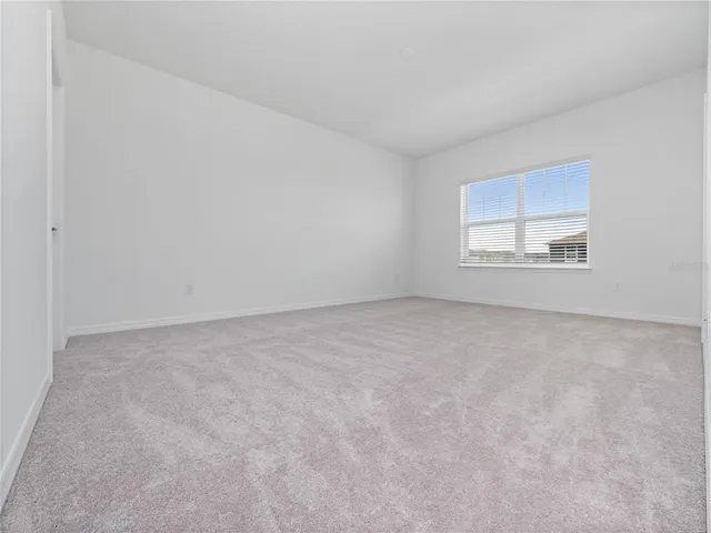 a bathroom with a double vanity sink a toilet and a mirror