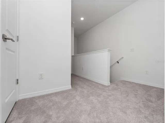 front view of a brick house with a yard