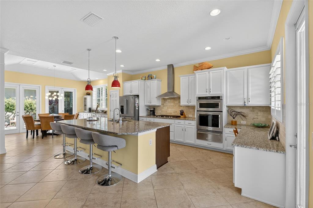 6903 Crestpoint Drive Apollo Beach, FL 33572 - Photo 32 of 95 a large kitchen with cabinets
