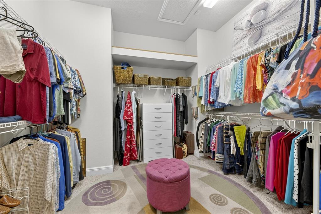 6903 Crestpoint Drive Apollo Beach, FL 33572 - Photo 48 of 95 a view of walk in closet with clothes and shoes