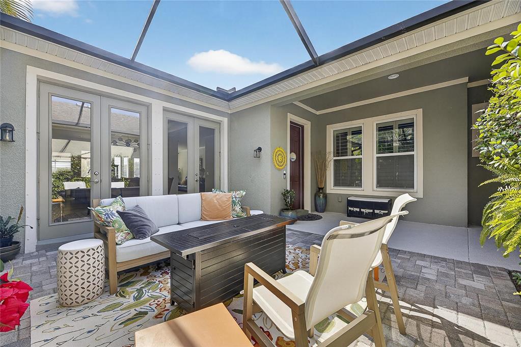 6903 Crestpoint Drive Apollo Beach, FL 33572 - Photo 53 of 95 a outdoor space with patio the couches and a dining table with garden view