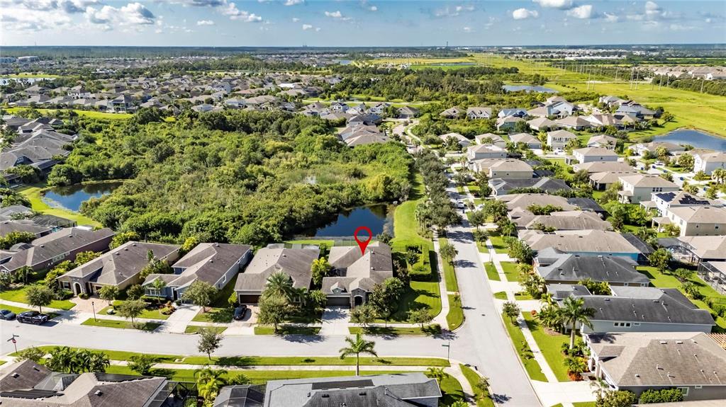 6903 Crestpoint Drive Apollo Beach, FL 33572 - Photo 74 of 95 an aerial view of residential houses with outdoor space and swimming pool