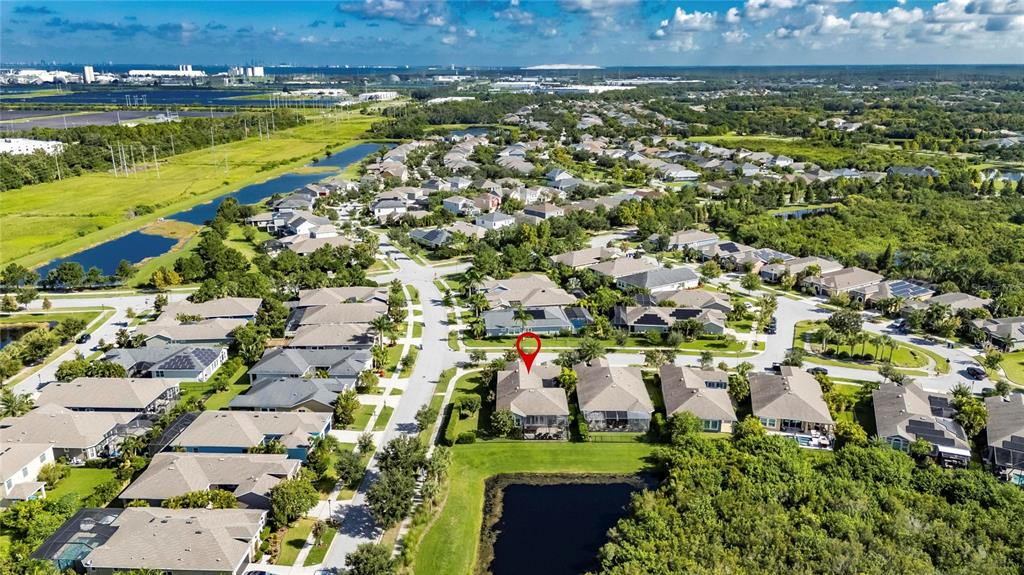 6903 Crestpoint Drive Apollo Beach, FL 33572 - Photo 76 of 95 an aerial view of residential houses with outdoor space and trees