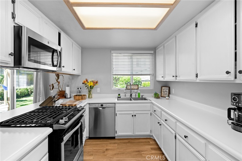 4239 Shadowcrest Drive Santa Maria, CA 93455 - Photo 12 of 33 a kitchen with stainless steel appliances granite countertop a sink stove and cabinets