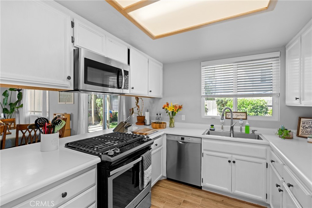 4239 Shadowcrest Drive Santa Maria, CA 93455 - Photo 14 of 33 a kitchen with a stove a sink and a microwave