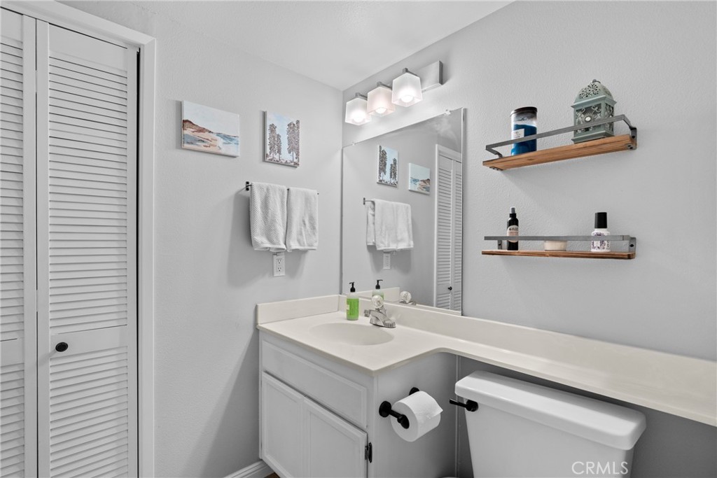 4239 Shadowcrest Drive Santa Maria, CA 93455 - Photo 15 of 33 a bathroom with a sink a toilet and mirror