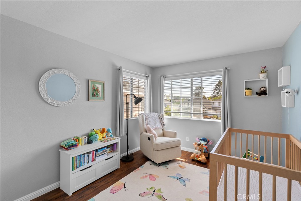 4239 Shadowcrest Drive Santa Maria, CA 93455 - Photo 16 of 33 a living room with baby crib and a window