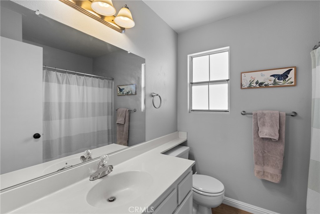 4239 Shadowcrest Drive Santa Maria, CA 93455 - Photo 17 of 33 a bathroom with a sink toilet and shower