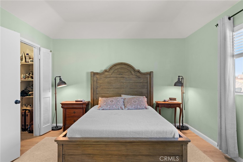 4239 Shadowcrest Drive Santa Maria, CA 93455 - Photo 20 of 33 a bedroom with a bed and wooden floor