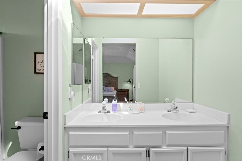 4239 Shadowcrest Drive Santa Maria, CA 93455 - Photo 23 of 33 a bathroom with a sink and a mirror