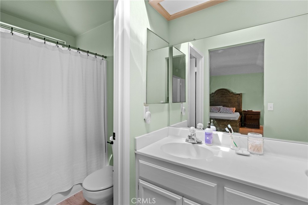 4239 Shadowcrest Drive Santa Maria, CA 93455 - Photo 24 of 33 a bathroom with a sink and a mirror