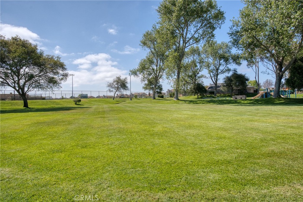 4239 Shadowcrest Drive Santa Maria, CA 93455 - Photo 32 of 33 a backyard of apartments with large trees