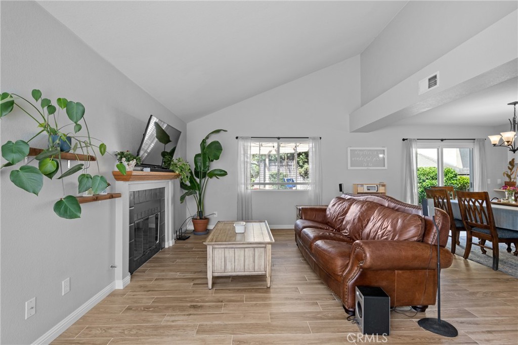 4239 Shadowcrest Drive Santa Maria, CA 93455 - Photo 4 of 33 a living room with furniture a fireplace and potted plants