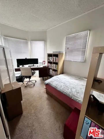 a bedroom with a bed and furniture