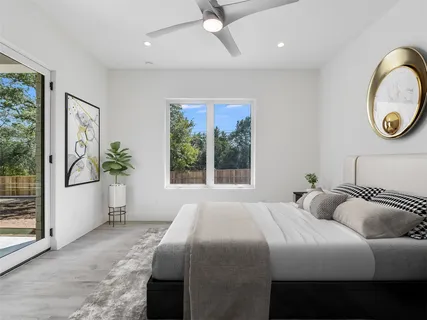 a spacious bathroom with a double vanity sink a mirror a bathtub and shower