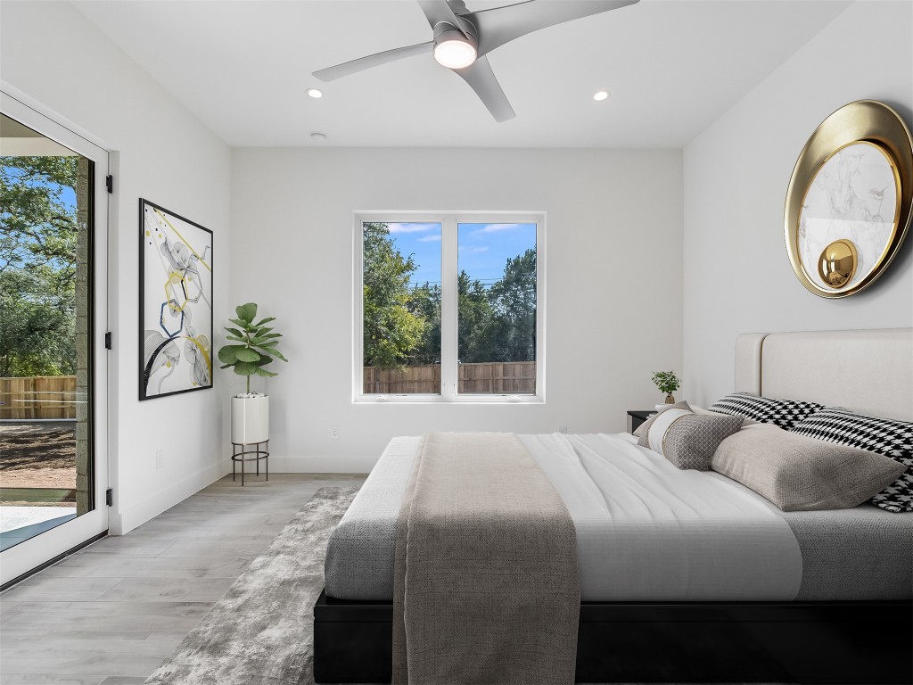 21 Champions Circle Wimberley, TX 78676 - Photo 14 of 27 a bedroom with a bed and a window