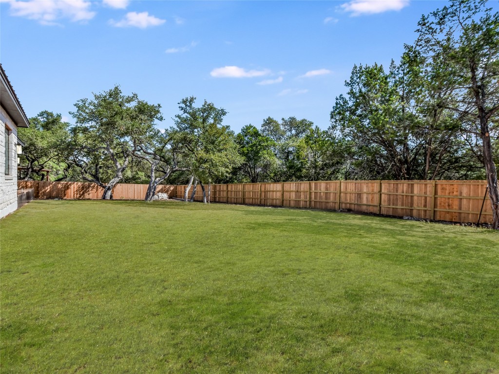 21 Champions Circle Wimberley, TX 78676 - Photo 26 of 27 a view of a yard with a trampoline