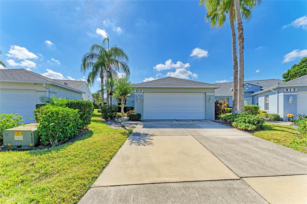 919 Spring Lakes Boulevard Bradenton, FL 34210 - Photo 2 of 43 a house view with a garden space