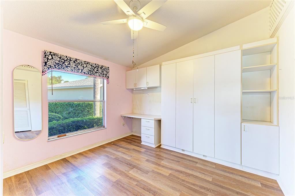 919 Spring Lakes Boulevard Bradenton, FL 34210 - Photo 27 of 43 wooden floor in an empty room with a window
