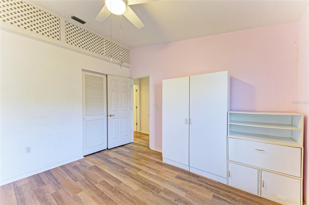 919 Spring Lakes Boulevard Bradenton, FL 34210 - Photo 28 of 43 a view of empty room with wooden floor