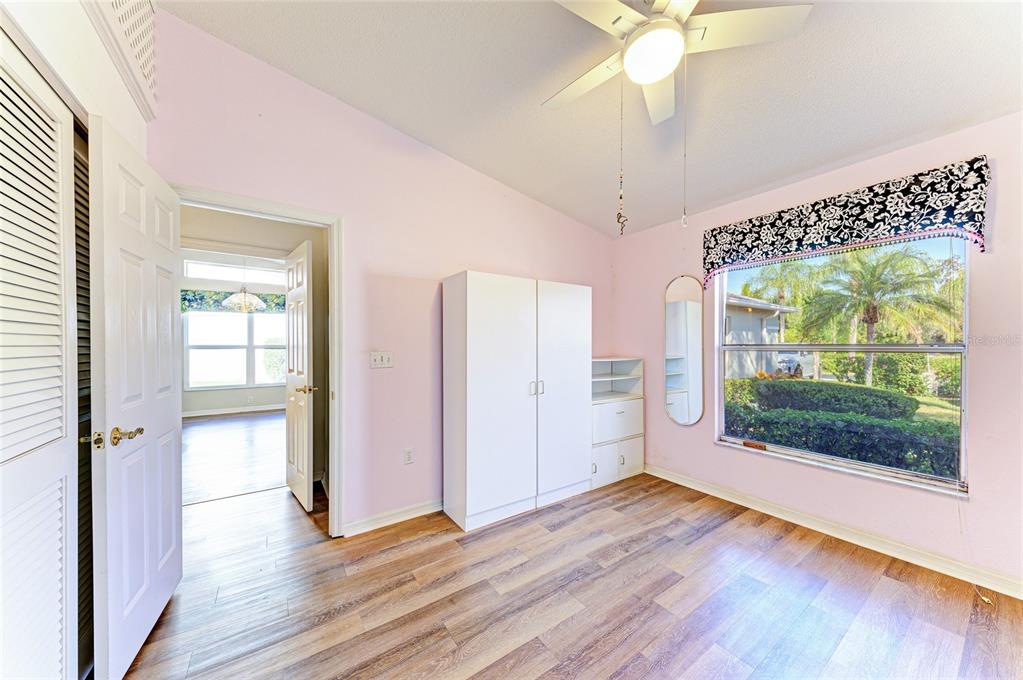 919 Spring Lakes Boulevard Bradenton, FL 34210 - Photo 29 of 43 a view of an entryway with wooden floor and door