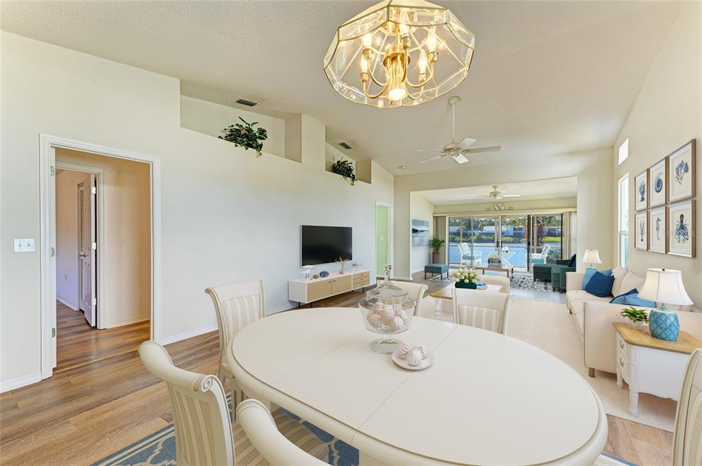 919 Spring Lakes Boulevard Bradenton, FL 34210 - Photo 4 of 43 a view of a dining room with furniture