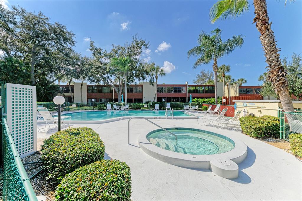 919 Spring Lakes Boulevard Bradenton, FL 34210 - Photo 42 of 43 a view of a swimming pool with a patio