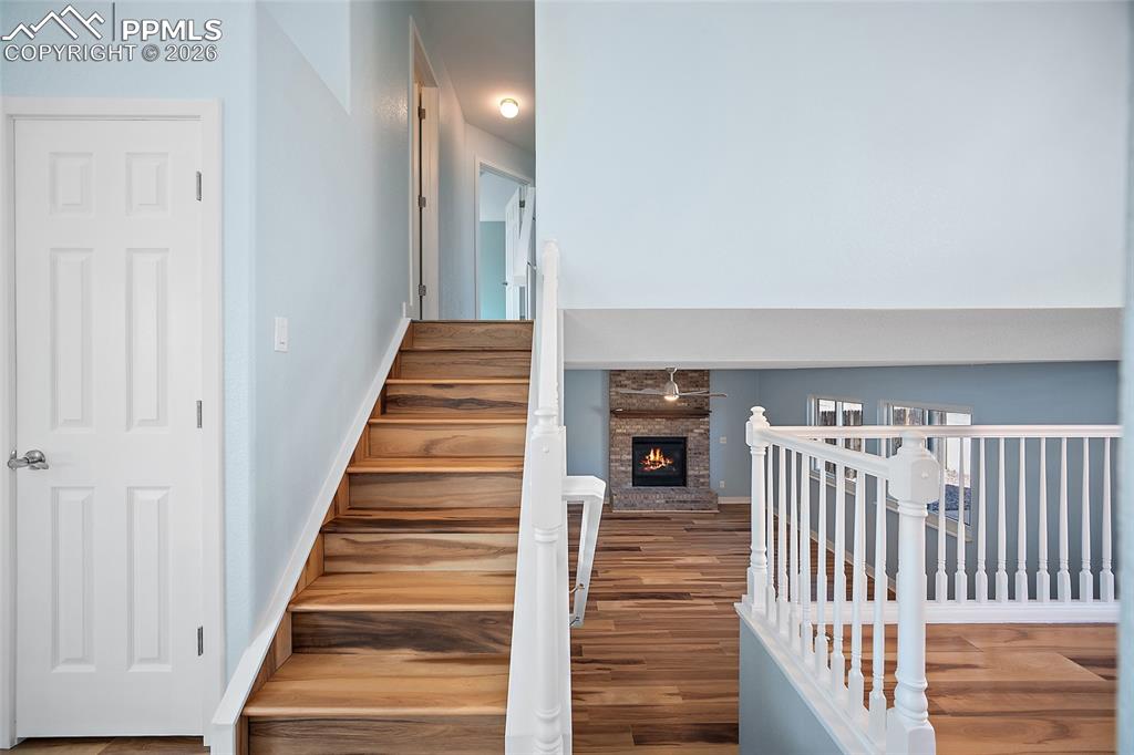 4923 Brant Road Colorado Springs, CO 80911 - Photo 7 of 25 Stairs to upstairs and lower living room area.