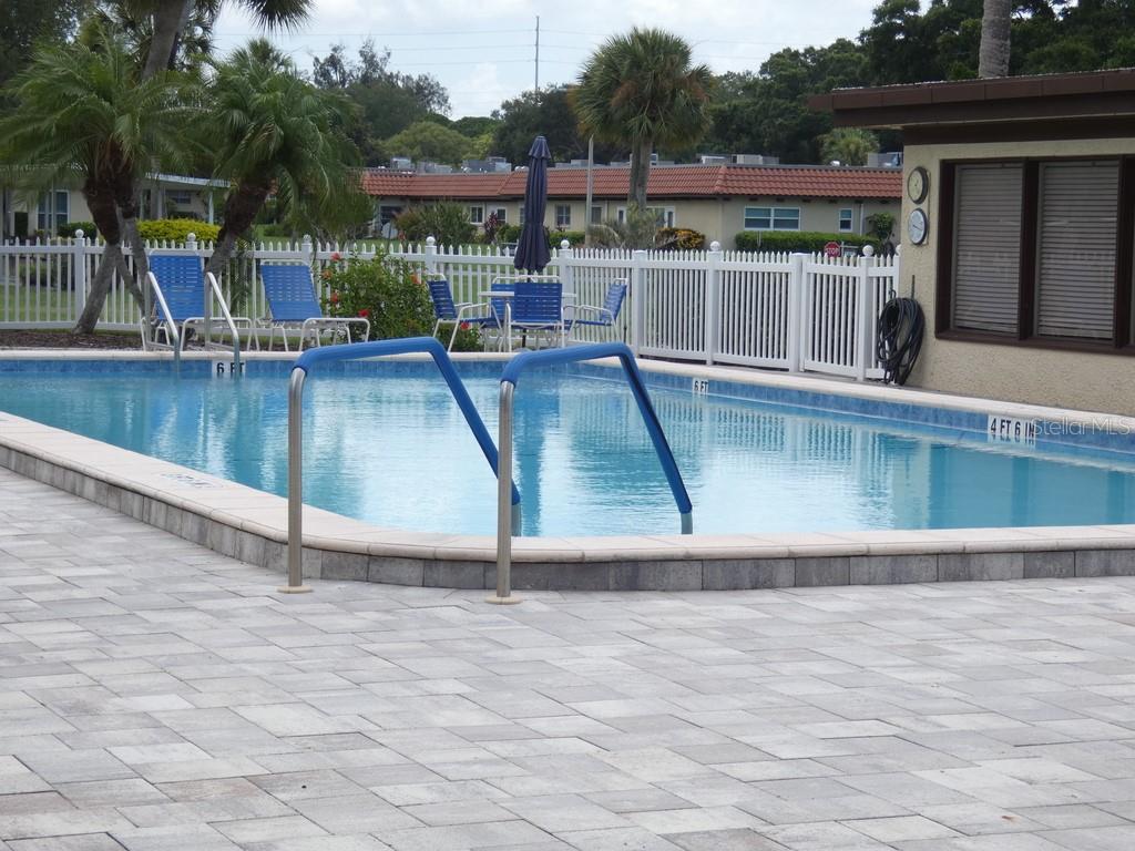 1701 Pinehurst Road, Unit 9G Dunedin, FL 34698 - Photo 15 of 22 swimming pool view with a outdoor seating