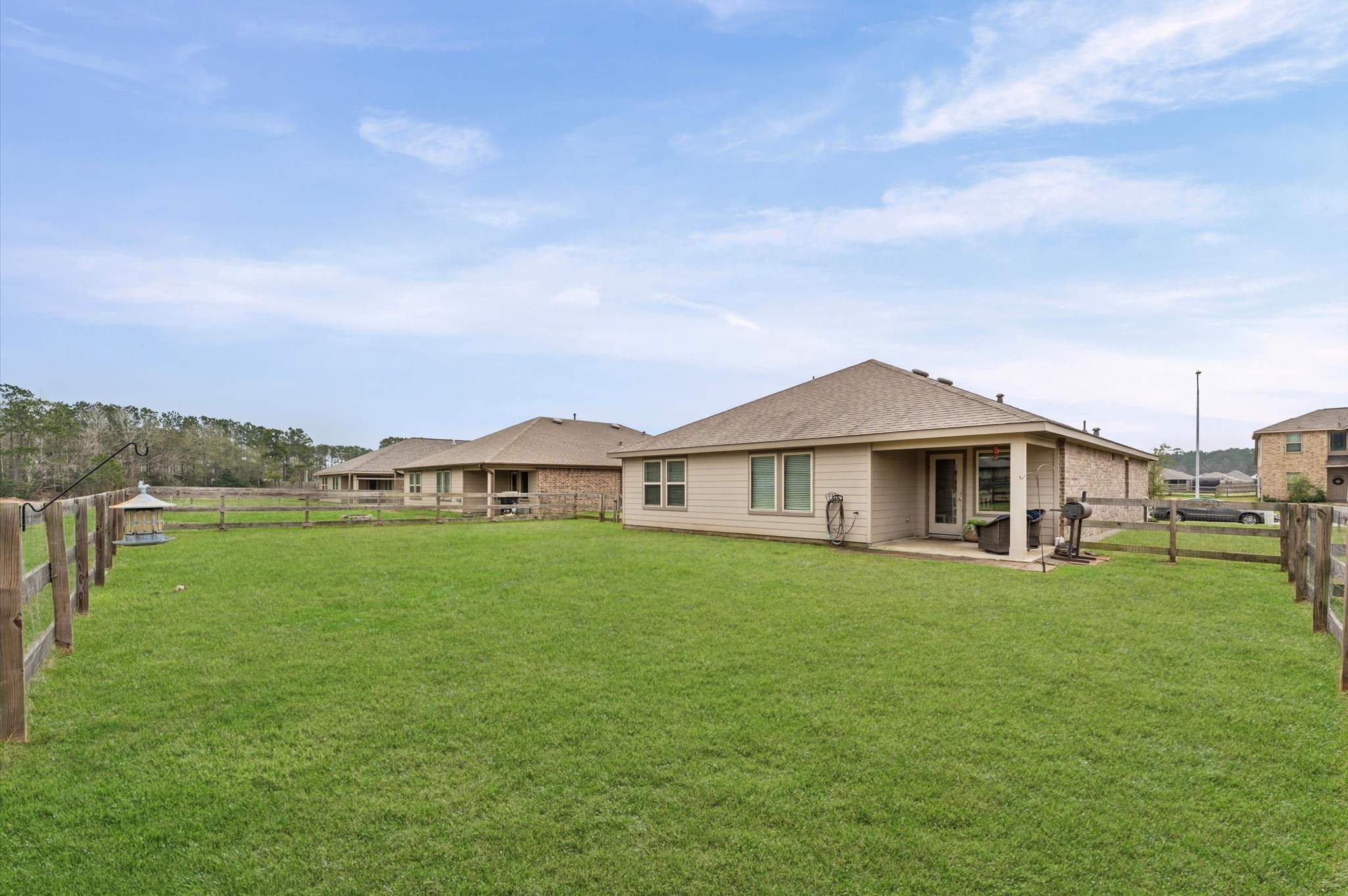 222 Kickapoo Drive Anahuac, TX 77514 - Photo 15 of 17 a view of a house with a big yard