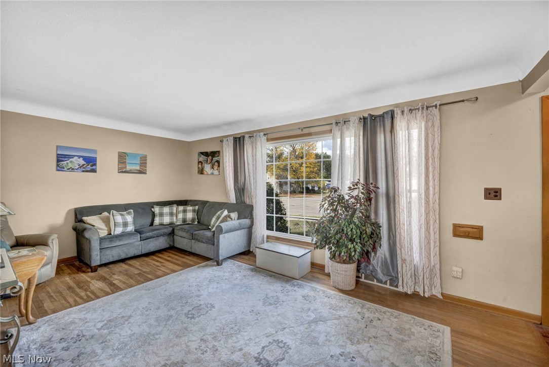 30002 Barjode Road Willowick, OH 44095 - Photo 11 of 33 Living room featuring wood finished floors and baseboards