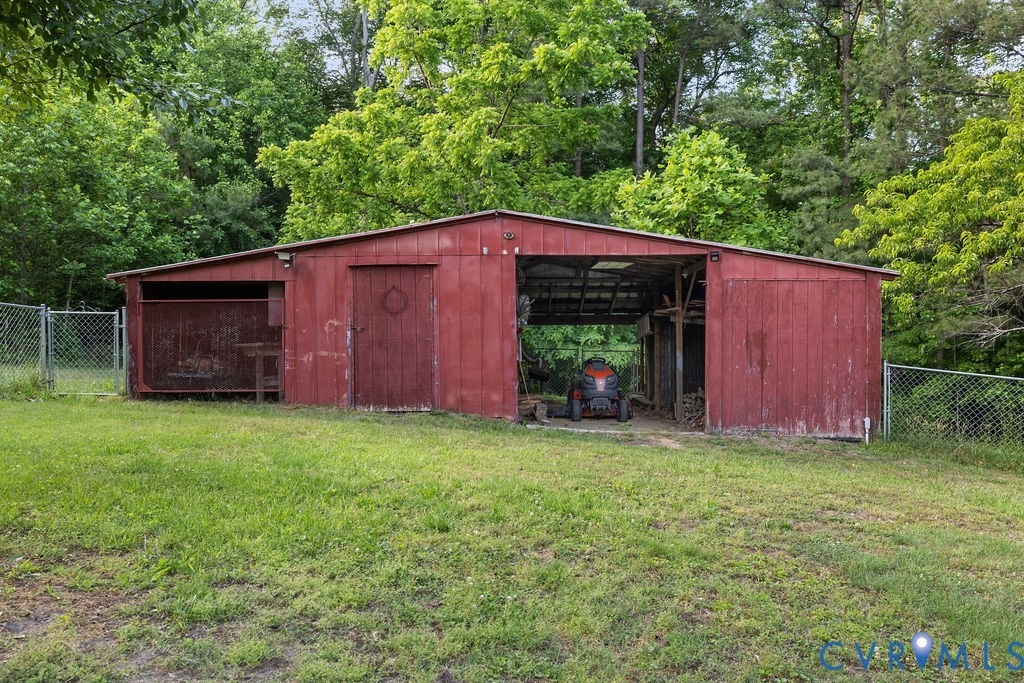 9500 West Providence Road Chesterfield, VA 23236 - Photo 17 of 21 Red multi-use outbuilding featuring a sloped roof,