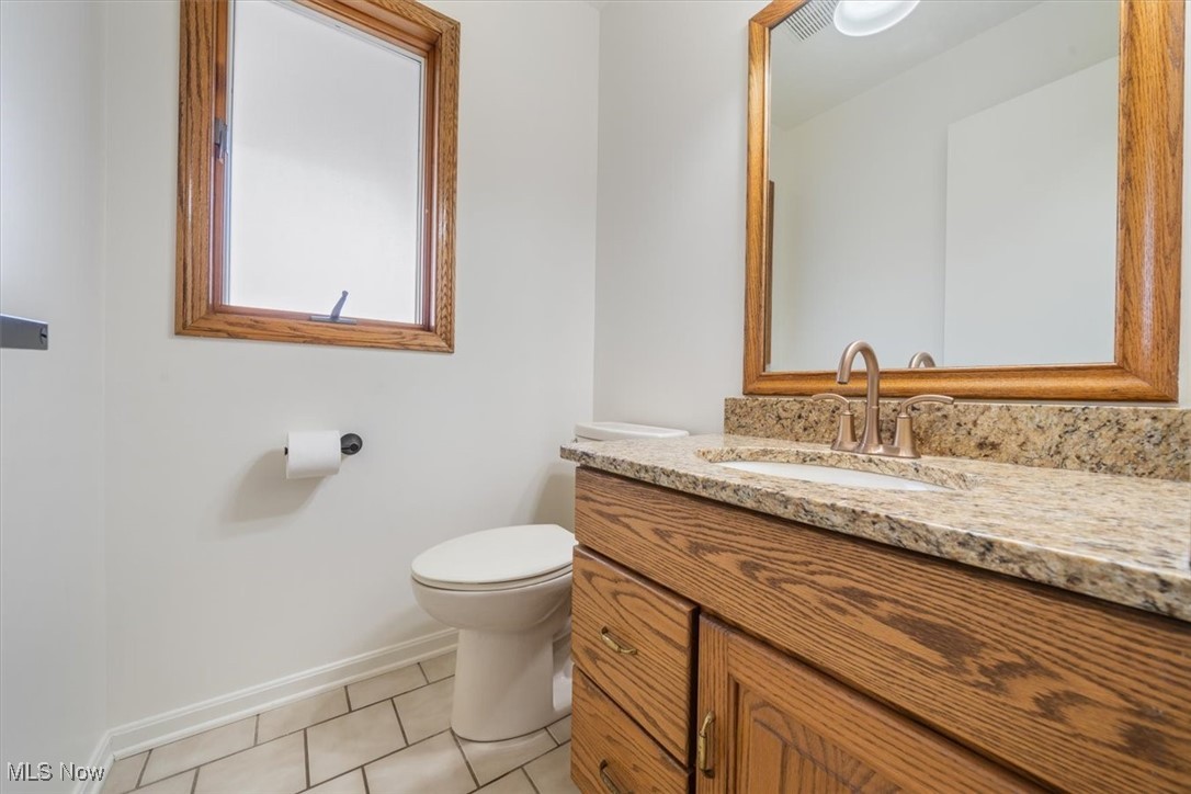 3520 Hunting Run Road Medina, OH 44256 - Photo 28 of 47 Bathroom featuring tile patterned flooring, vanity, and toilet
