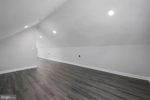 a view of room with wooden floor