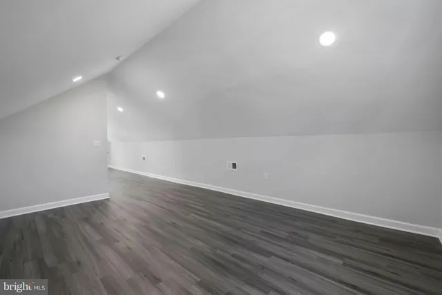 a view of room with wooden floor