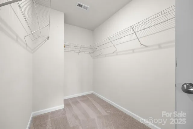 a view of a room with racks on the wall