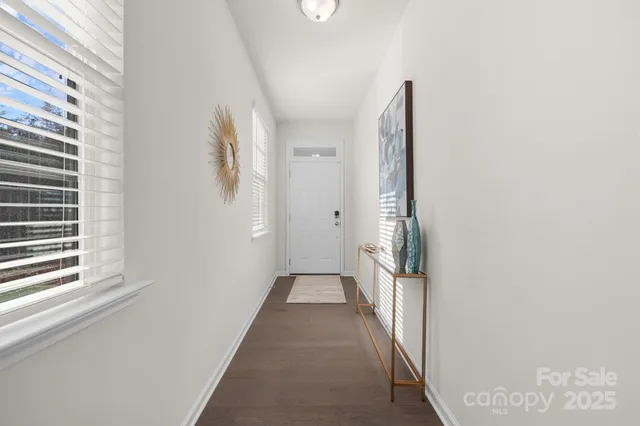 a view of a hallway with windows