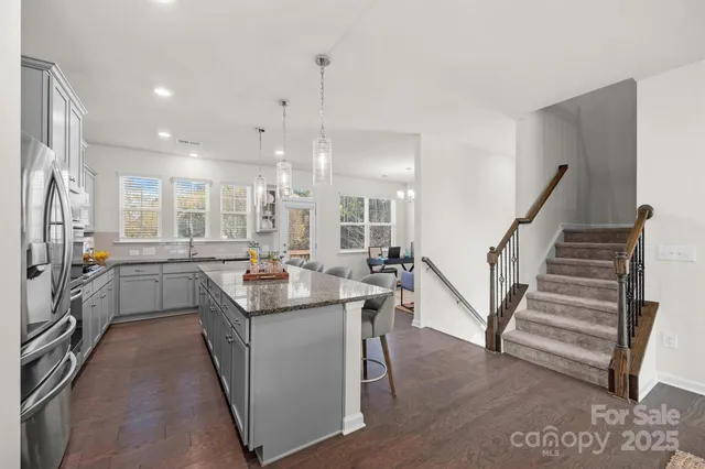 a kitchen with sink cabinets and stove