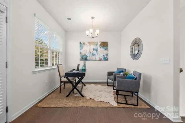 a view of a livingroom with furniture and a window