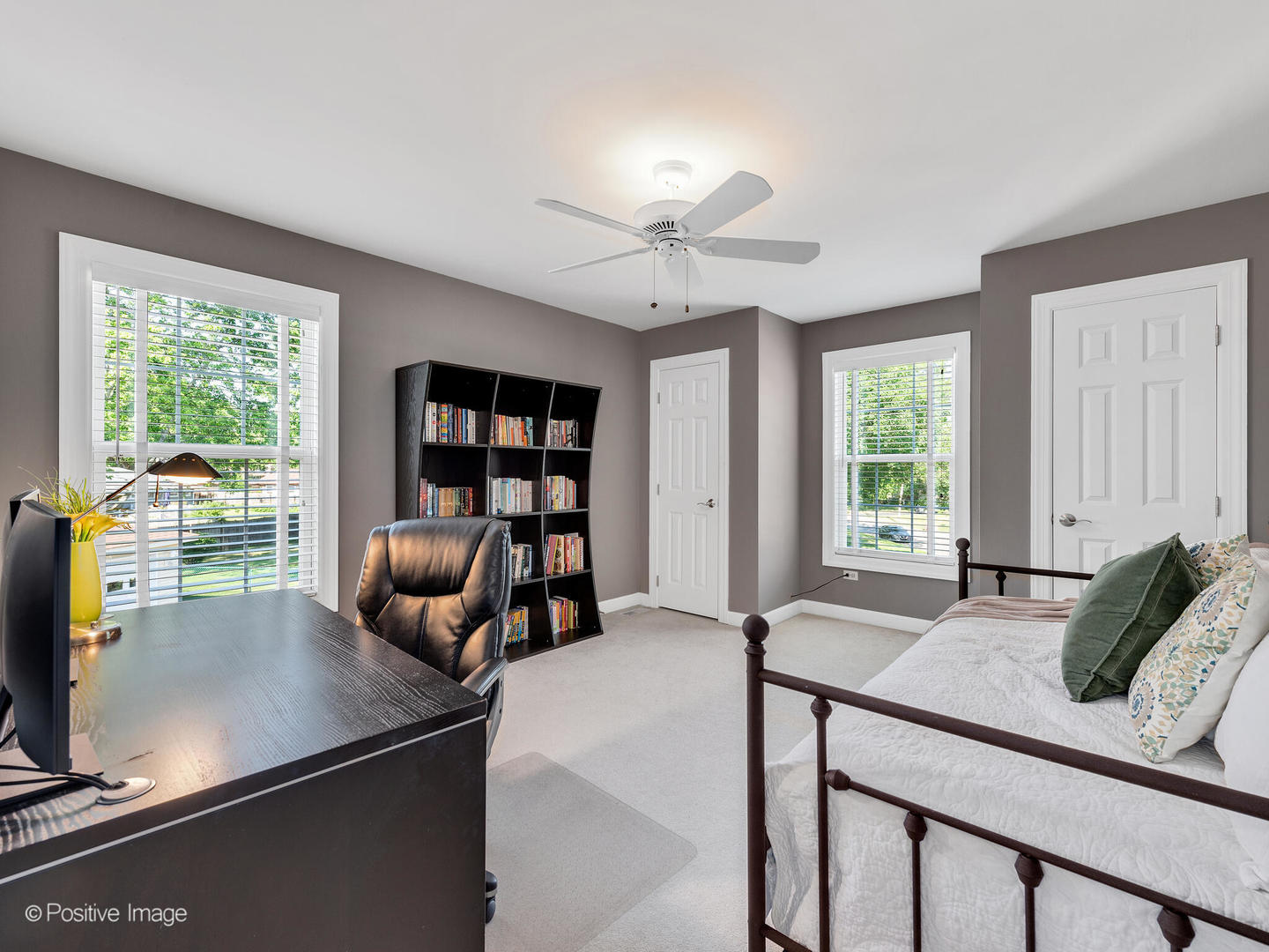 822 Ranch Road Wheaton, IL 60187 - Photo 23 of 36 a living room with furniture a bookshelf and a large window