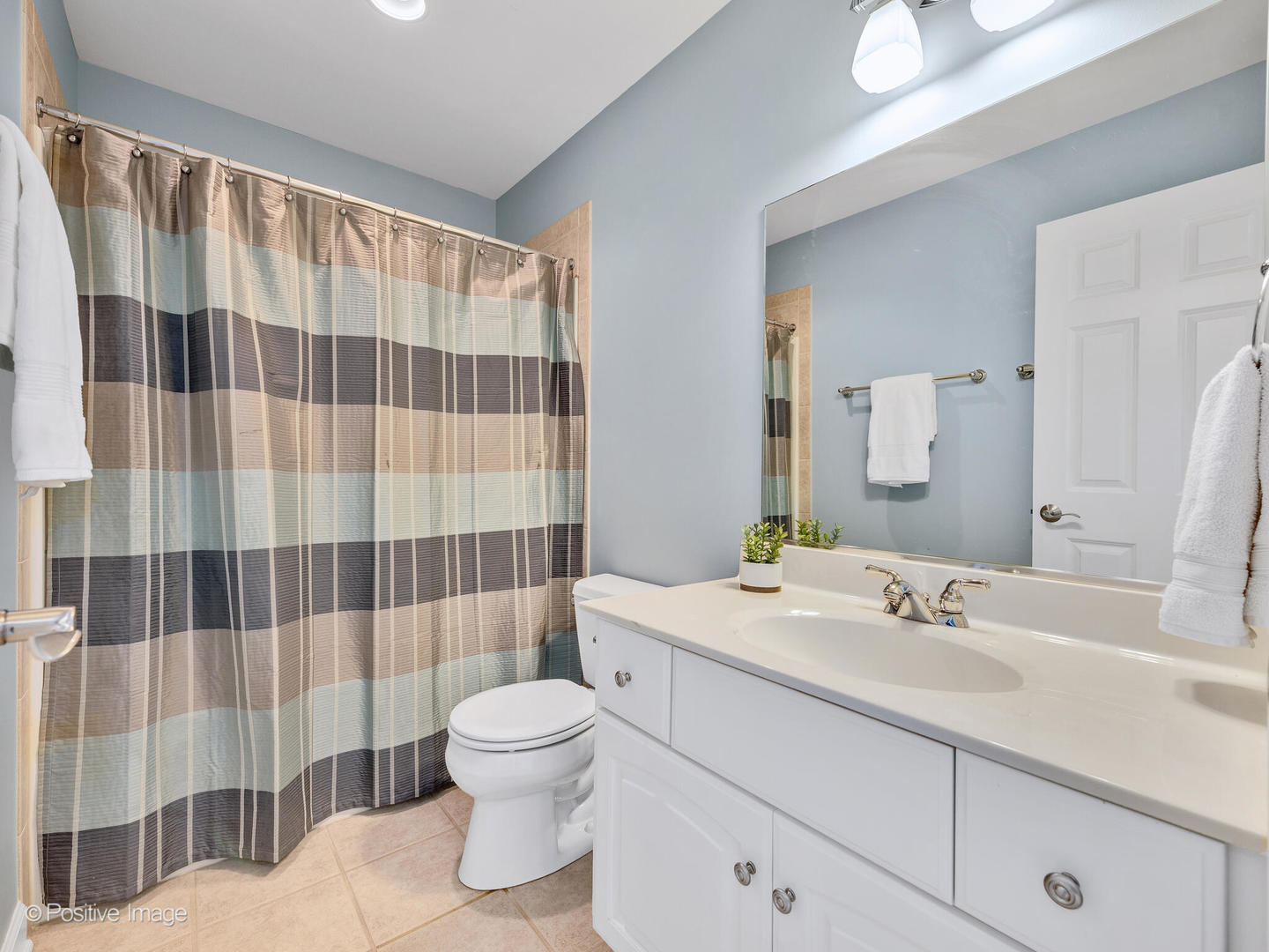 822 Ranch Road Wheaton, IL 60187 - Photo 24 of 36 a bathroom with a sink a toilet and shower