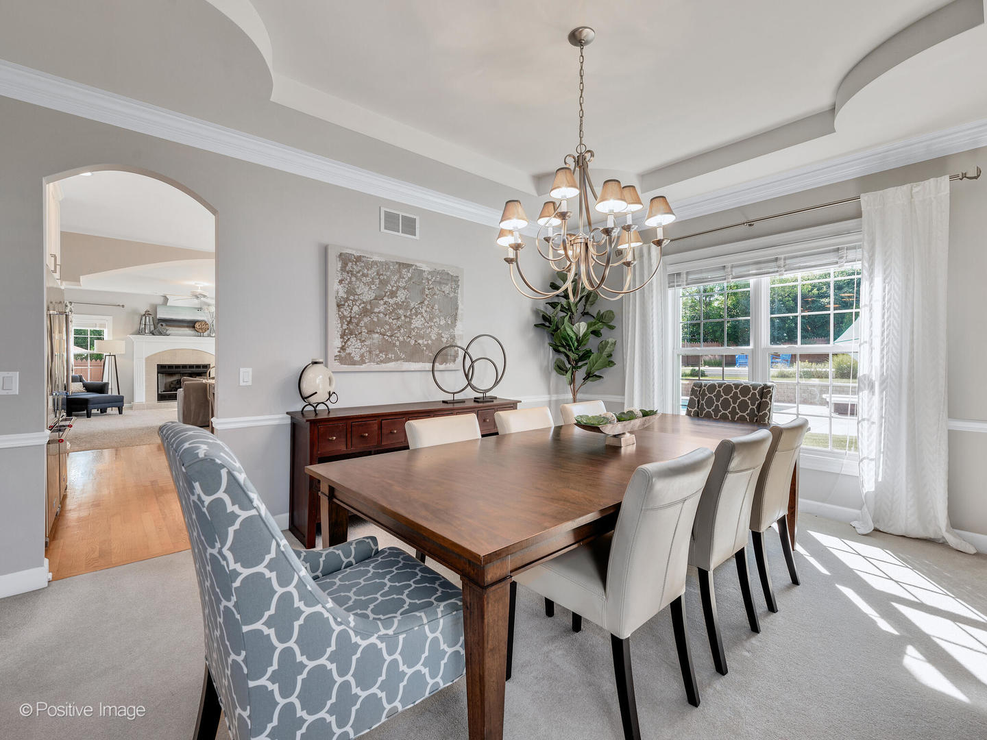 822 Ranch Road Wheaton, IL 60187 - Photo 5 of 36 a view of a dining room with furniture and chandelier
