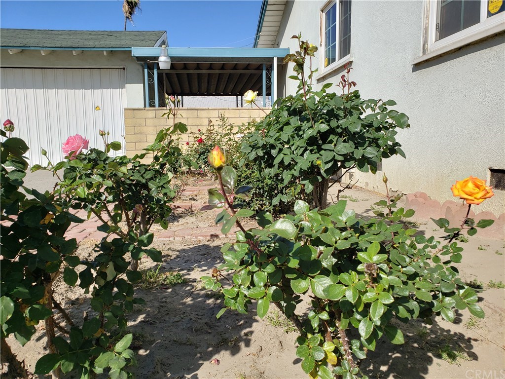 11929 Ranchito Street El Monte, CA 91732 - Photo 23 of 28 a backyard of a house with lots of green space
