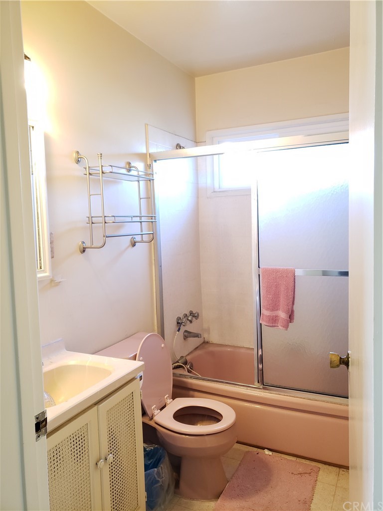 11929 Ranchito Street El Monte, CA 91732 - Photo 10 of 28 a bathroom with a sink a toilet and shower
