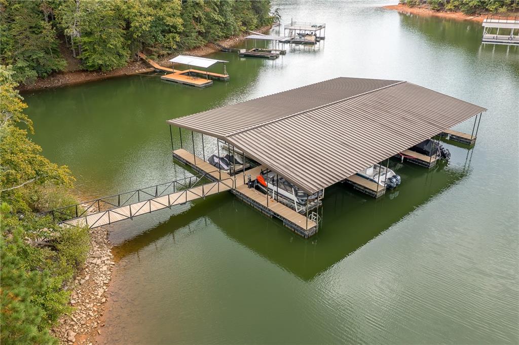 6008 Tradewinds Cove Gainesville, GA 30506 - Photo 2 of 73 an aerial view of a house with a lake view