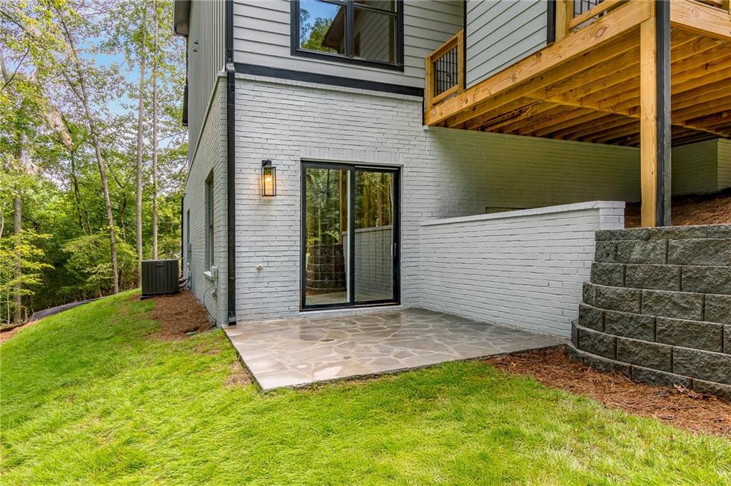 6008 Tradewinds Cove Gainesville, GA 30506 - Photo 10 of 73 a view of a house with a yard