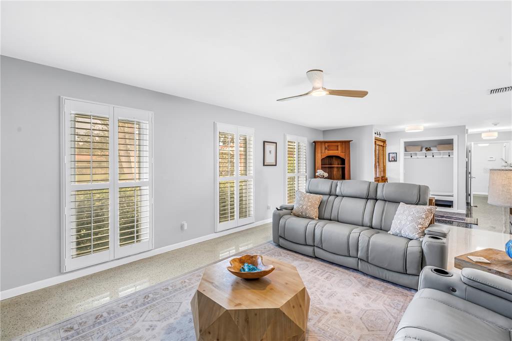 14546 Anchorage Circle Seminole, FL 33776 - Photo 11 of 88 a living room with furniture and a window
